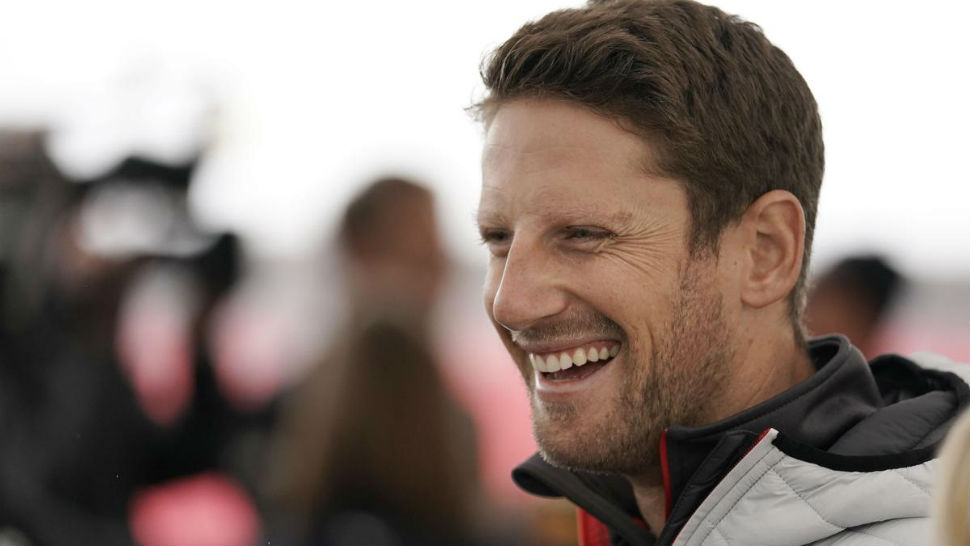 Haas driver Romain Grosjean, of France, laughs during a media availability for the Formula One U.S. Grand Prix auto race at the Circuit of the Americas, Thursday, Oct. 18, 2018, in Austin, Texas. (AP Photo/Darren Abate)