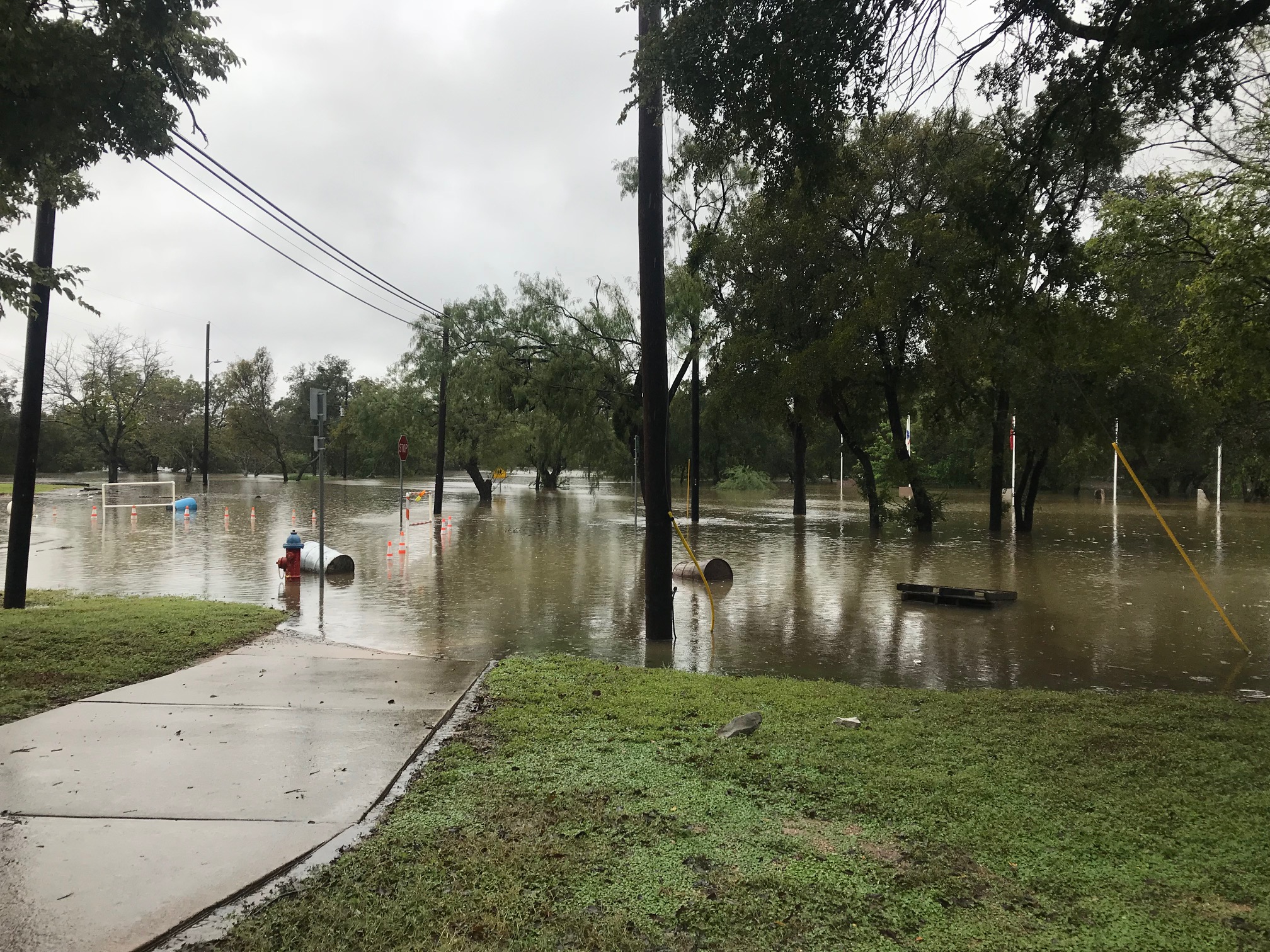 A photograph of Yett St. and Ave. J flooded (Credit Spectrum News reporter Stacy Rickard)