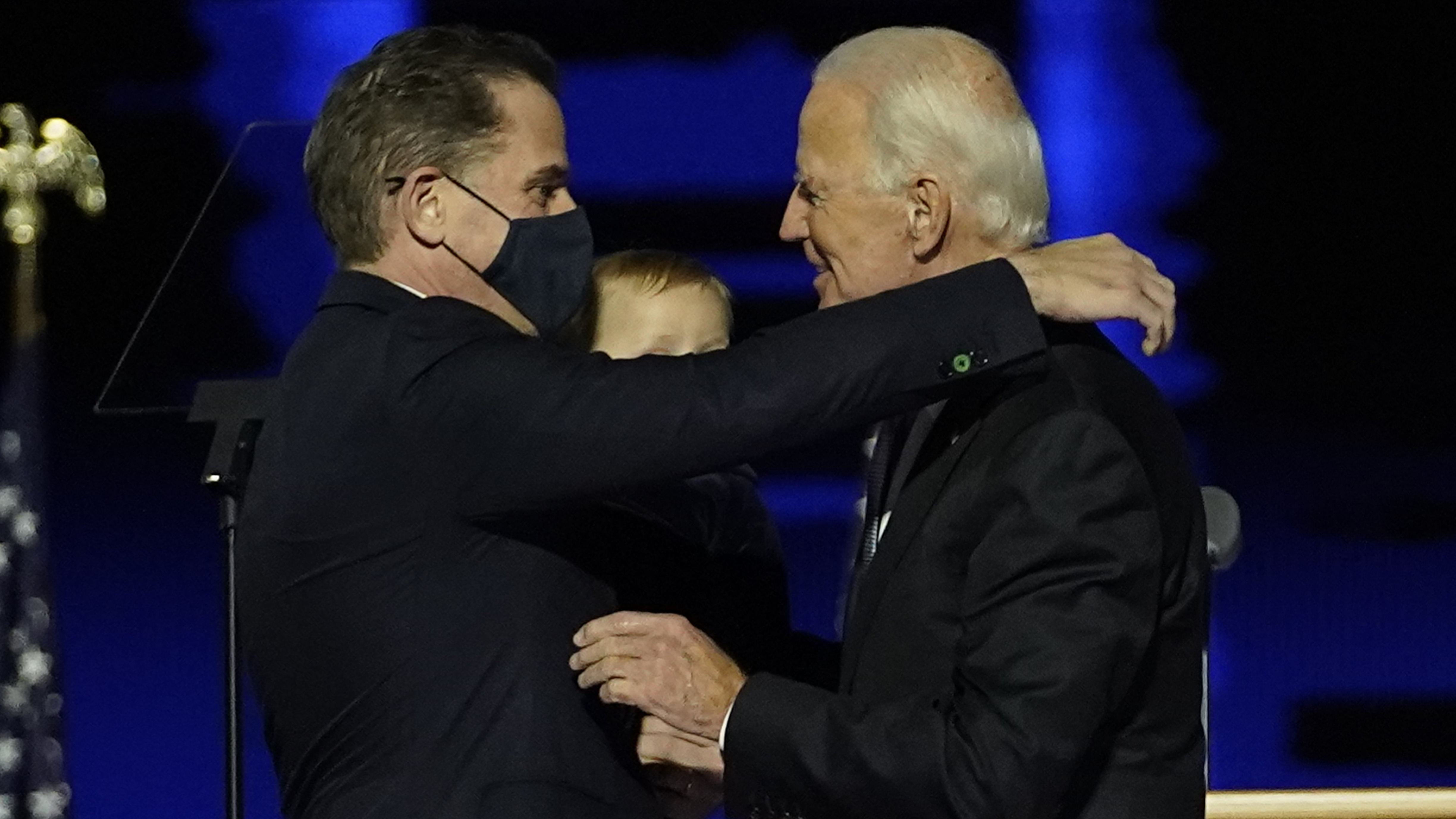 President-elect Joe Biden, right, embraces his son Hunter Biden, left, Saturday, Nov. 7, 2020, in Wilmington, Del. (AP Photo/Andrew Harnik, Pool)