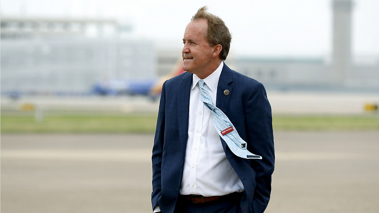 In this June 28, 2020 file photo, Texas' Attorney General Ken Paxton waits on the flight line for the arrival of former Vice President Mike Pence at Love Field in Dallas. (AP Photo/Tony Gutierrez, File)