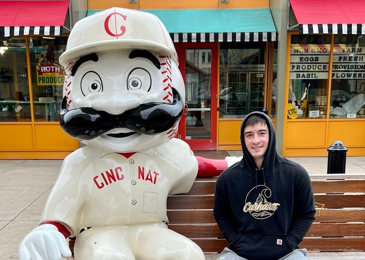 UC freshman Baylor Rowell poses for a picture with a Mr. Redlegs at Findlay Market. (Photo courtesy of Baylor Rowell)
