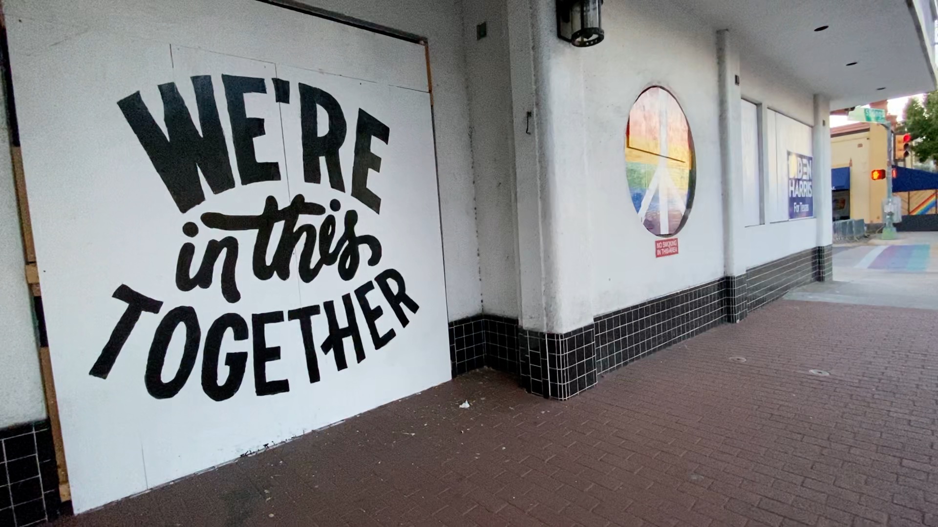"We're In This Together" sign outside of JR's Bar (Spectrum News)
